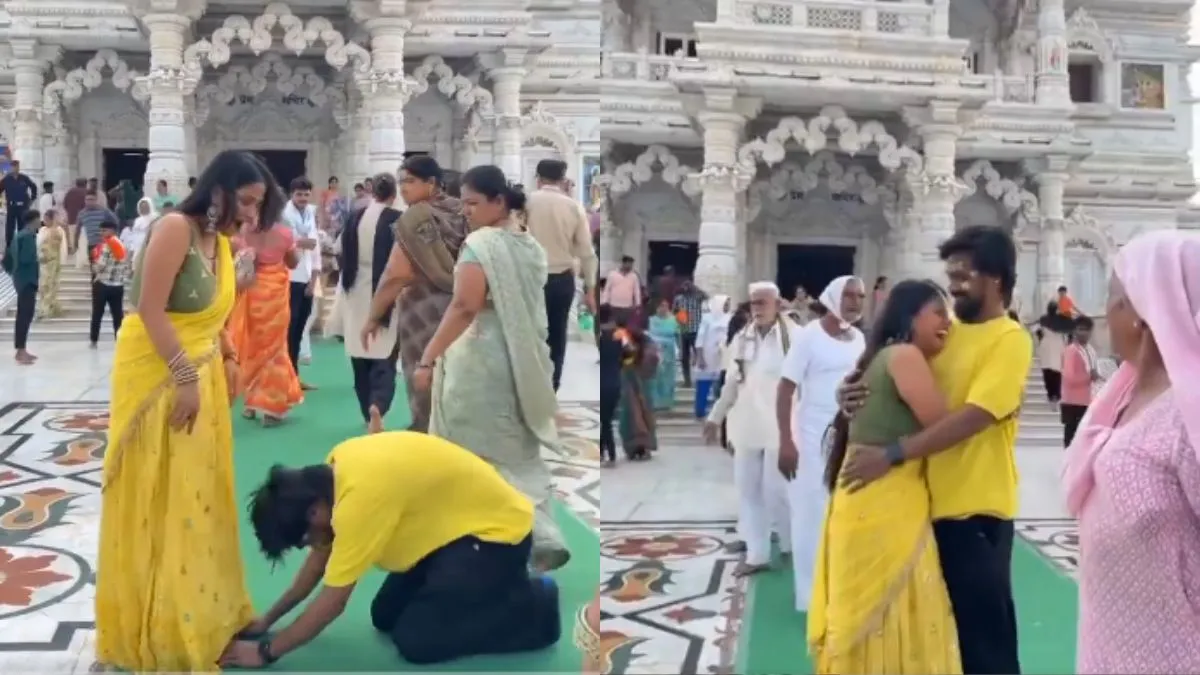 मंदिर के बाहर पत्नी के पैर छूते हुए पति- India TV Hindi