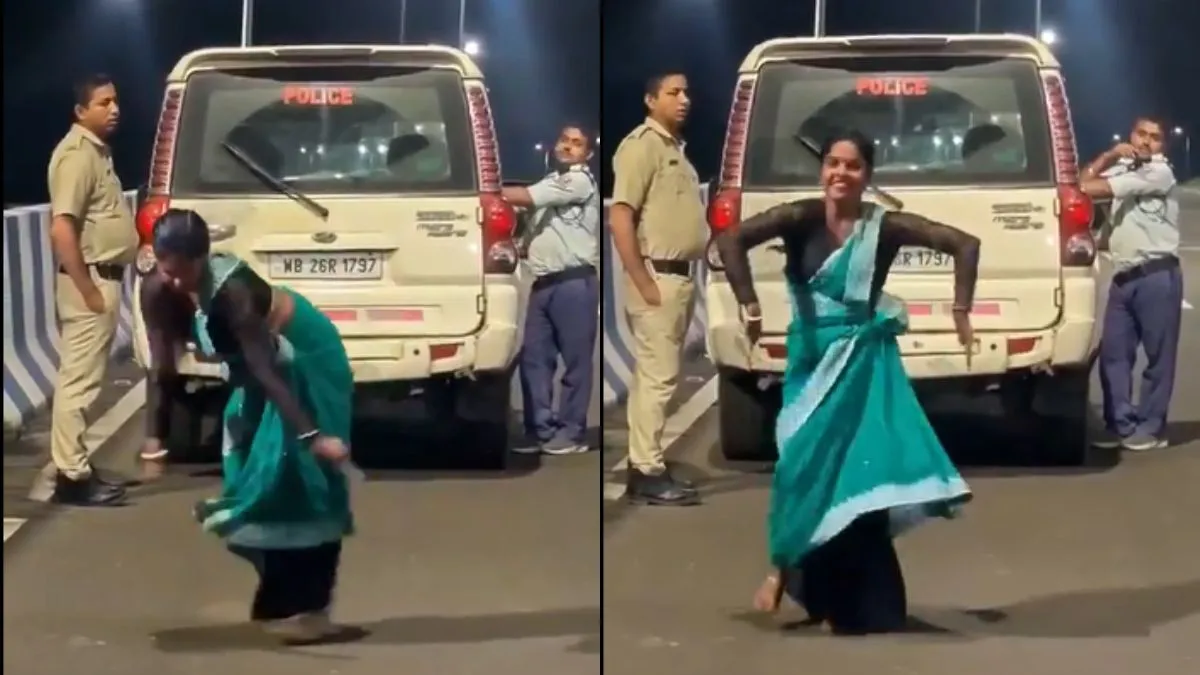 पुलिस के सामने डांस करती हुई महिला- India TV Hindi