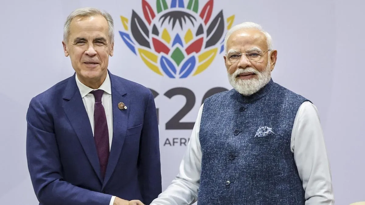 PM Narendra Modi (R) and Canadian PM Mark Carney (L), on the sidelines of the G20 Summit in Johannes- India TV Hindi