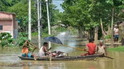 <p>Flood-affected villagers use a boat to take a patient to...- India TV Hindi