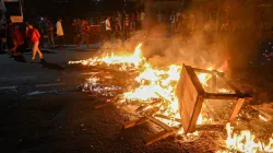 <p>Protestors burn tyres and public property on road during...- India TV Hindi