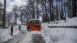 A snow cutter clears the Jammu-Srinagar national highway following fresh snowfall, at Patnitop.- India TV Hindi