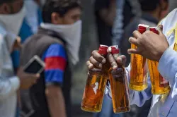 <p> A man walks away after buying liquor from a wine...- India TV Hindi