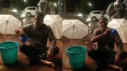 Milind Soman Taking bath in middle of the road users asked what is this new exercise watch video - India TV Hindi