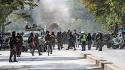 Taliban fighters stand guard at the explosion site, near a mosque, in Kabul, Afghanistan- India TV Hindi