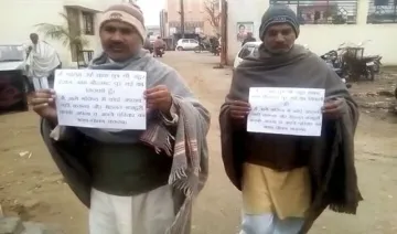 Scared-of-encounter-goons-walk-with-placards-in-UP-saying-they-will-behave- India TV Hindi