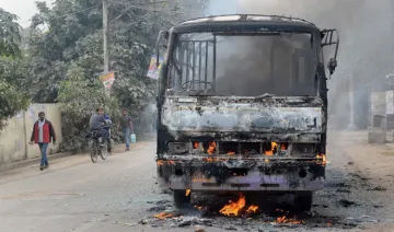 Angry students set ablaze a city bus during a protest in...- India TV Hindi