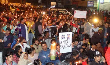 People taking out a candle march demanding justice for...- India TV Hindi