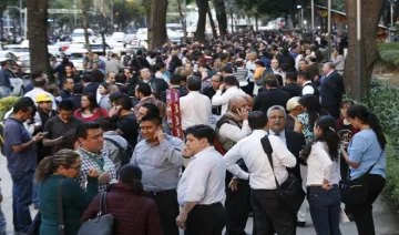 People stand along Reforma Avenue after a 7.2-magnitude...- India TV Hindi
