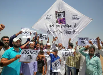 <p>People display kites and placard during a protest...- India TV Hindi