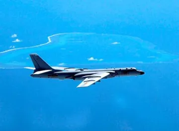 <p>China Lands Bomber on South China Sea Island for First...- India TV Hindi