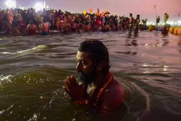 <p>A Sadhu takes a holy dip at Sangam on the auspicious day...- India TV Hindi