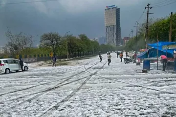 <p>A view of a street after hailstorm struck various parts...- India TV Hindi