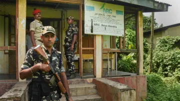 Guwahati: Security personnel keep vigil outside the office of the State Coordinator of National Regi- India TV Hindi