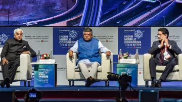 Union Telecom Minister Ravi Shankar Prasad flanked by Telecom Secretary Anshu Prakash (L) and Aditya- India TV Paisa