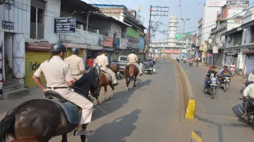 Mounted Police personnel patrol in a street as part of precautionary measures in view of Supreme Cou- India TV Hindi