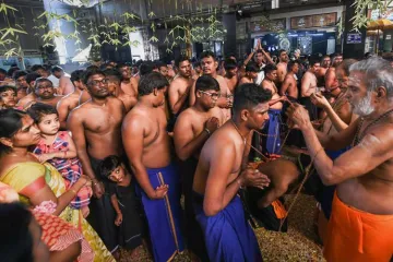 <p>A devotee wears the 'sacred chain' at a temple before...- India TV Hindi