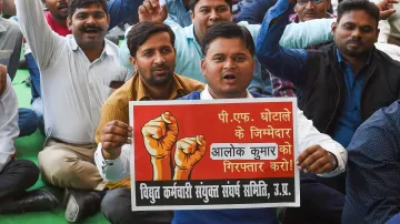 UPPCL employees raise slogans as they began their 48-hour work boycott, in Lucknow.- India TV Hindi