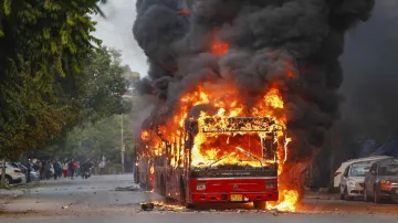 <p>bus set on fire following protests against the passage...- India TV Hindi