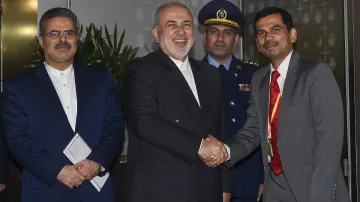 Iran's Foreign Minister Mohammad Javad Zarif being received as he arrives at the airport in New Delh- India TV Hindi