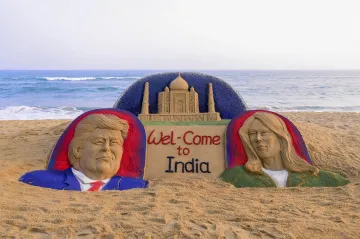 <p>Sand sculpture on US President Donald Trump with First...- India TV Hindi