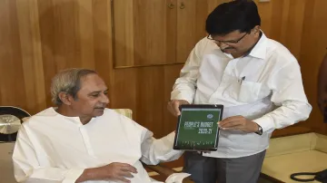 Odisha Finance Minister Niranjan Pujari (R) presents a copy of the Digital Budget 2020-21 to Chief M- India TV Hindi