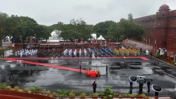 Tri-Service bands and Delhi Police contingent march-past during full dress rehearsals for the 74th I- India TV Hindi