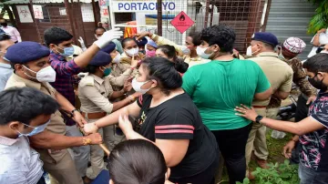 Police personnel stop kins of the victims to enter Shrey hospital after a major fire broke out in it- India TV Hindi