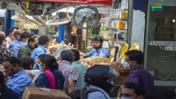 <p>New Delhi: People buy dry fruits from a shop at Chandni...- India TV Hindi