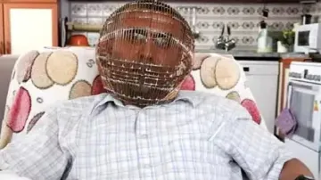 man head in cage- India TV Hindi