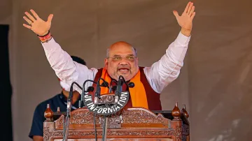 Union Home Minister Amit Shah addresses during a public rally at Bhagwati Nagar in Jammu on Sunday.- India TV Hindi