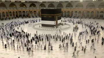 Muslim pilgrims circumambulate the Kaaba, the cubic building at the Grand Mosque, in Mecca, Saudi Ar- India TV Hindi