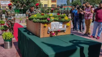 Security personnel pay tribute to the mortal remains of Axel- India TV Hindi
