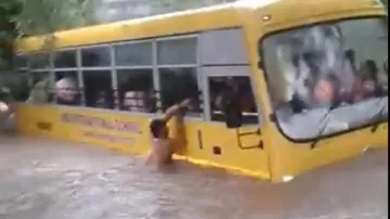 School bus stuck in water. Villagers Rescue- India TV Hindi