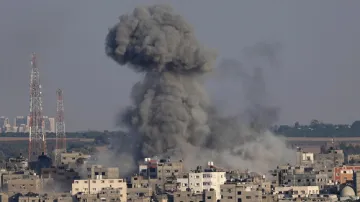 Smoke rises after Israeli airstrikes on a residential building in Gaza- India TV Hindi