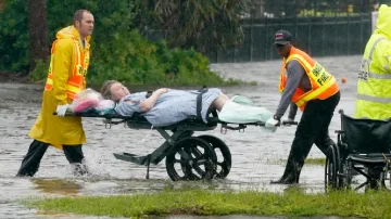 Authorities transport a person out of the Avante nursing home in the aftermath of Hurricane Ian- India TV Hindi