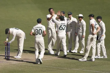 Australia team celebrating a wicket against West Indies at...- India TV Hindi