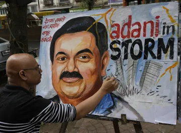 Adani to raise Rs 21,000 cr from share sale in two group cos- India TV Paisa
