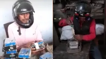 बागपत के बीजली विभाग के ऑफिस में कर्मचारियों को हेलमेट लगाकर काम करना पड़ रहा है। - India TV Hindi