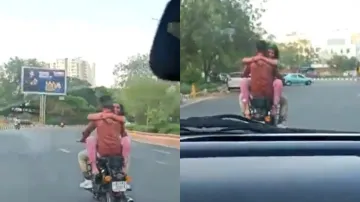 बुलेट की टंकी पर बैठी हुई लड़की और ड्राइव करता हुआ उसका बॉयफ्रेंड।- India TV Hindi