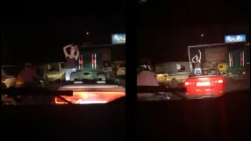 कार में खड़े होकर डांस करते हुए लड़की।- India TV Hindi