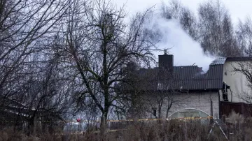 Smoke rises from the site where a DHL cargo plane crashed into a house near Vilnius, Lithuania.- India TV Hindi