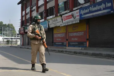 <p>A security personnel patrols a street during...- India TV Hindi