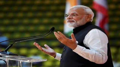 Prime Minister Narendra Modi gestures while addressing the crowd during the 'Sawasdee PM Modi’ event- India TV Paisa