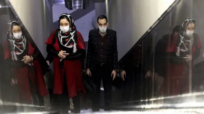 People wear masks to help guard against the Coronavirus as they ride an escalator at a the metro sta- India TV Hindi