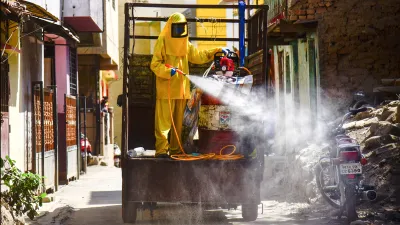 <p>Workers spray disinfectant in a residential area to...- India TV Hindi