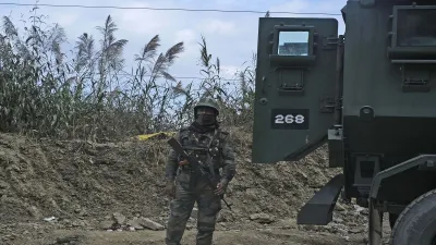 <p>An Indian army soldier stands guard on a highway on the...- India TV Hindi