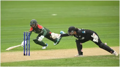 Jahanara Alam of Bangladesh dives to the crease as Katey Martin of New Zealand attempts to run out - India TV Hindi