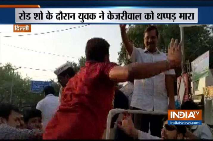 Delhi CM Arvind Kejriwal assaulted by a man during his road show Delhi CM Arvind Kejriwal assaulted by a man during his road show- India TV Hindi