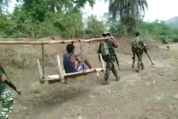 CRPF found a severely ill boy in a Chhattisgarh village and carried him on a cot for 8 km for treatm CRPF found a severely ill boy in a Chhattisgarh village and carried him on a cot for 8 km for treatm- India TV Hindi